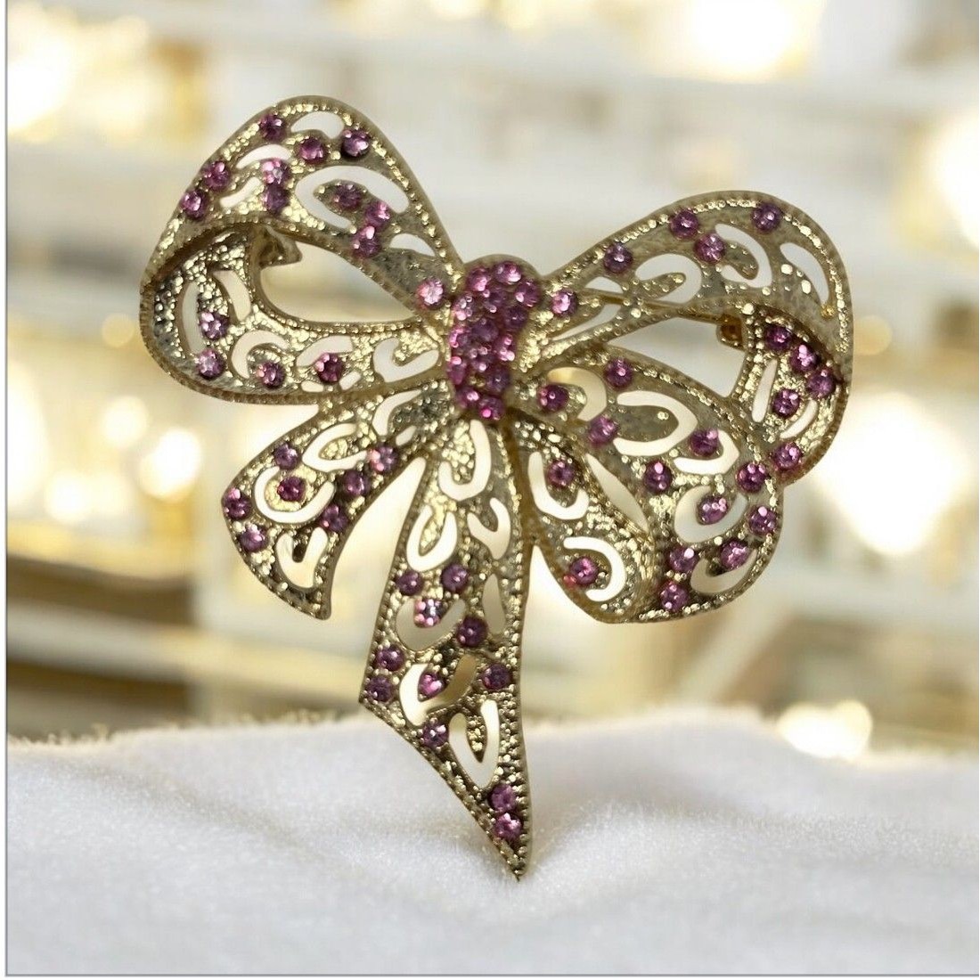 Fashion Goldtone Bow Brooch With Pink Rhinestones Elegant Openwork Design